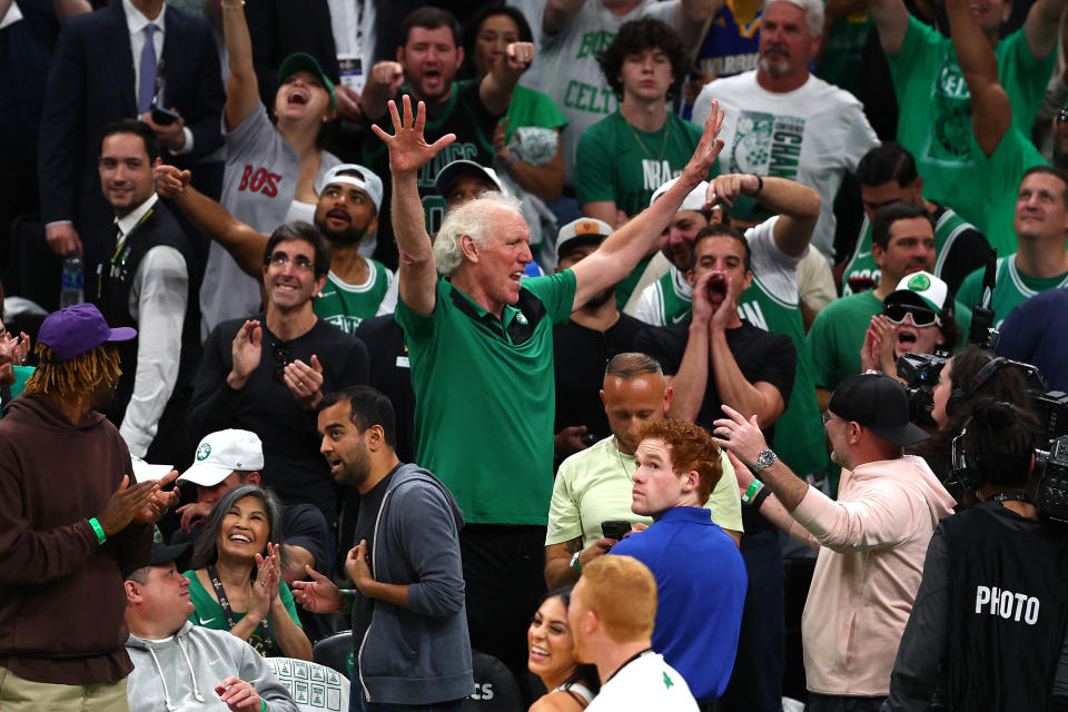 Former Boston Celtics player Bill Walton waves to fans in the crowd during Game Four of the 2022 NBA Finals on June 10, 2022 in Boston, Mass.