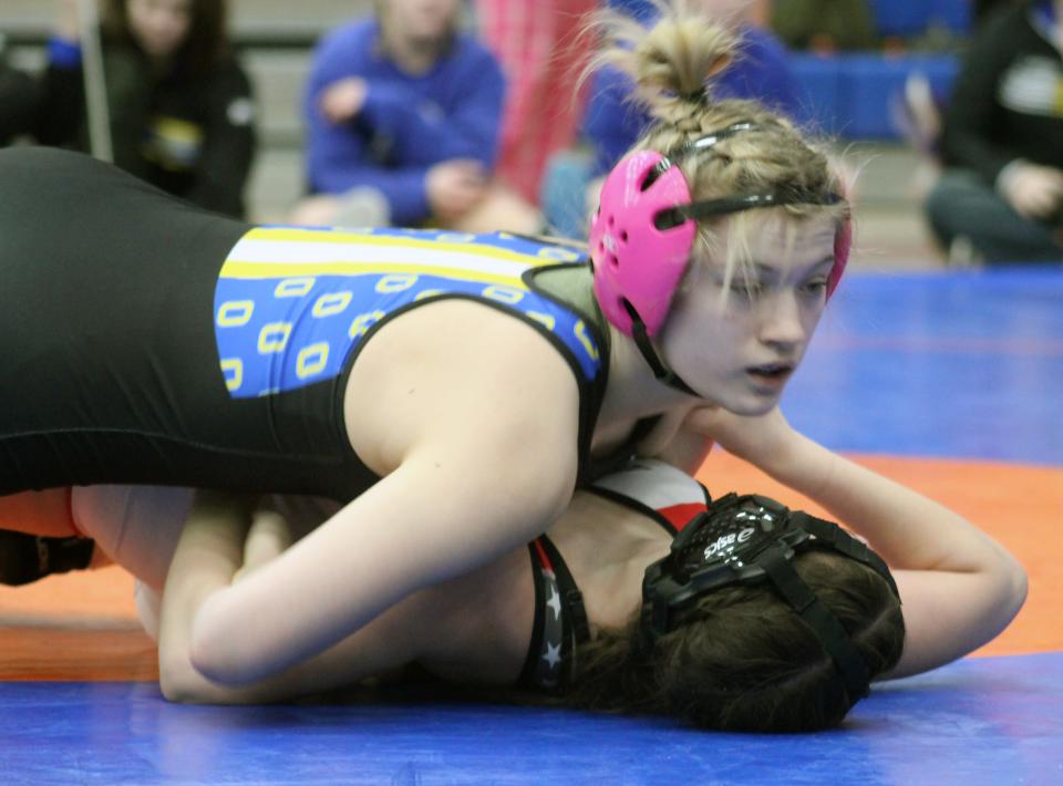 Olentangy's Cori Young records a pin on her way to winning the 115-pound title in the Pioneer Classic on Saturday at Olentangy Orange.