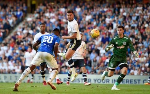 Alfredo Morelos scores with a header - Credit: pa