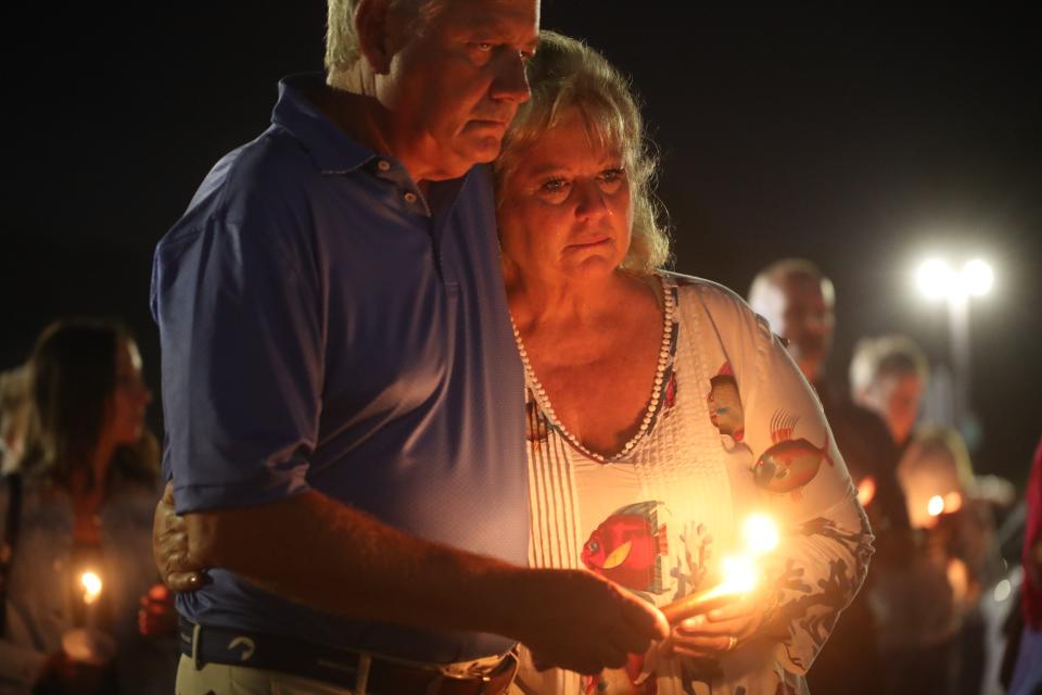 More than a 150 people gathered at Lee Memorial Hospital on Wednesday, Dec. 8, 2021 to hold a candlelight vigil for Crave Culinaire owner and chef Brian Roland. He was critically injured in an accident after he was pinned beneath the elevator platform at Ferrari of Naples on Saturday night. 