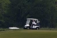 U.S. President Donald Trump participates in a round of golf at the Trump National Golf Course in Sterling, Virginia