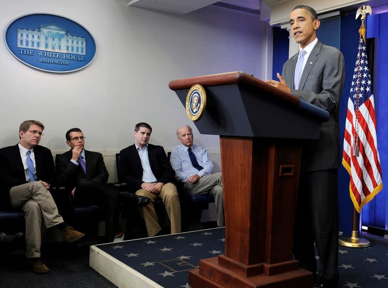 FILE PHOTO: US President Obama is flanked by advisors as he delivers remarks at the White House in Washington