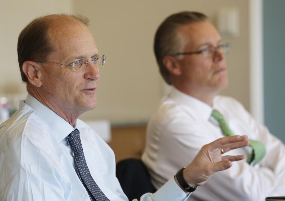 In this Tuesday, May 21, 2013 photo, Delta Air Lines CEO Richard Anderson, left, talks during an interview, in New York. President Ed Bastian is at right. Delta Air Lines is on track for its fourth straight annual profit, its best stretch since the six years ended in 2000. (AP Photo/Mark Lennihan)