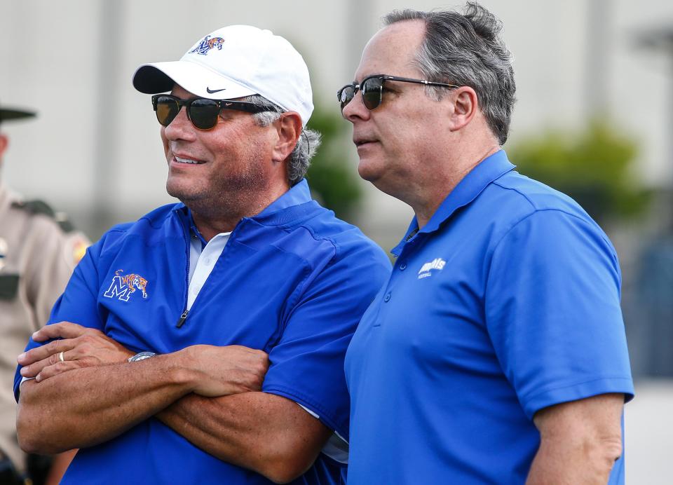 August 14, 2016 - University of Memphis Athletic Director Tom Bowen (left) and President David Rudd chat with each other during the Tigers scrimmage at Trinity Christian Academy  in Jackson, Tenn., last month. According to reports Friday by ESPN, Memphis was not among the Big 12 expansion finalist.  (Mark Weber/The Commercial Appeal)