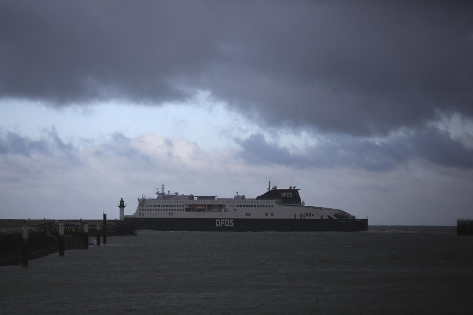A ferry bound for Britain leaves the port of Calais, northern France, Thursday, Nov. 25, 2021 in . Children and pregnant women were among at least 27 migrants who died when their small boat sank in an attempted crossing of the English Channel, a French government official said Thursday. French Interior Minister Gerald Darmanin also announced the arrest of a fifth suspected smuggler thought to have been involved in what was the deadliest migration tragedy to date on the dangerous sea lane. (AP Photo/Rafael Yaghobzadeh)