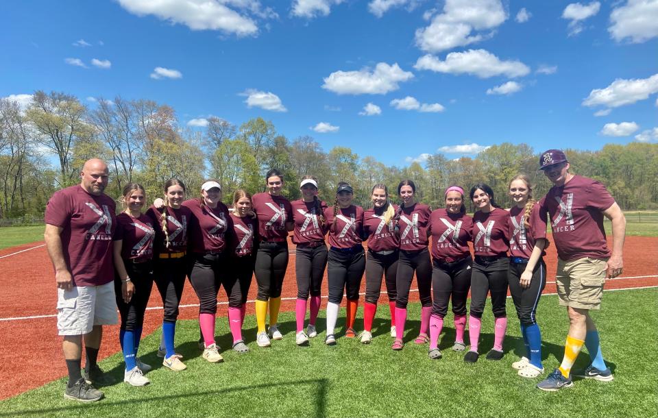 The Arlington softball team poses on its field after a win over Roy C. Ketcham on May 6, 2023. The Admirals sported alternate uniforms with a backwards "K" logo as part of their Strike Out Cancer event.