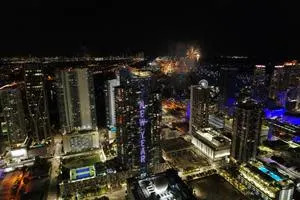 The world&#x002019;s tallest electronic New Year&#x002019;s Countdown Clock; the world&#x002019;s biggest animated Champagne Geyser; and the world&#x002019;s largest Digital Fireworks display light-up the South Florida skyline this holiday weekend, at the 60-story Paramount Miami Worldcenter skyscraper in downtown Miami, seen here at midnight, Saturday, January 1, 2022. The 700-foot-high Paramount Miami Worldcenter is the &#x00201c;Magic City&#x002019;s&#x00201d; soaring signature residential tower, which features the world&#x002019;s tallest and most technologically-advanced animation lighting system. It took 16,000 LEDs to create the spectacular light show in Miami, where thousands of revelers gathered in downtown and at the nearby Miley Cyrus New Year&#x002019;s Eve Party, to ring in the new year. (Eva Marie Uzcategui/AP Images for Paramount Miami Worldcenter)