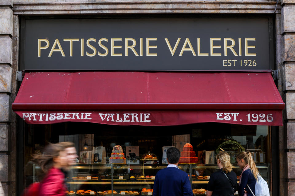 Pedestrians walk past a Patisserie Valerie cake store. Photo: Simon Dawson/Bloomberg via Getty Images