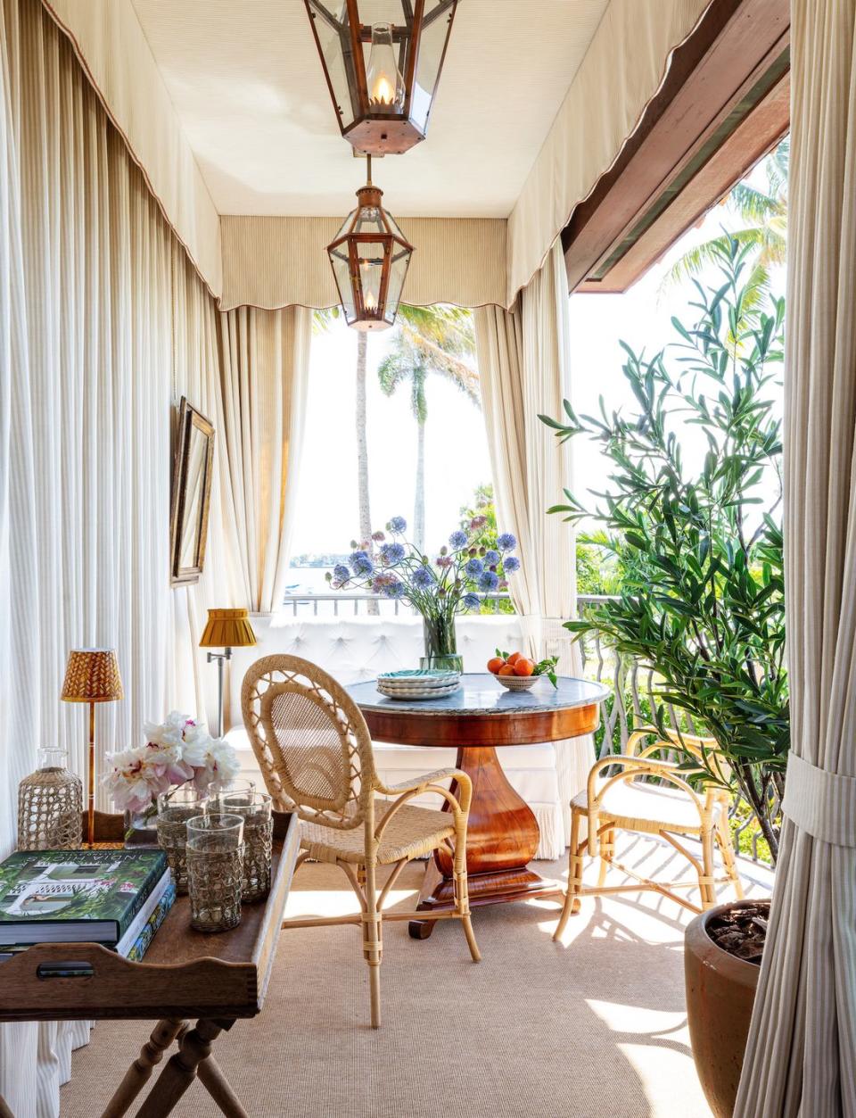 <p>Channeling Marrakech glamour, this breezy loggia feels like a far-off escape. <a href="http://www.annabraund.com/" rel="nofollow noopener" target="_blank" data-ylk="slk:Braund;elm:context_link;itc:0;sec:content-canvas" class="link ">Braund</a> wrapped the space with custom drapes from <a href="http://www.perennialsandsutherland.com/our-companies/perennials-fabrics/index.html" rel="nofollow noopener" target="_blank" data-ylk="slk:Sutherland Perennials;elm:context_link;itc:0;sec:content-canvas" class="link ">Sutherland Perennials</a> and added rattan chairs from <a href="https://bungalowclassic.com/" rel="nofollow noopener" target="_blank" data-ylk="slk:Bungalow Classic;elm:context_link;itc:0;sec:content-canvas" class="link ">Bungalow Classic</a> and an antique cherrywood table from <a href="https://robuck.co/" rel="nofollow noopener" target="_blank" data-ylk="slk:Robuck;elm:context_link;itc:0;sec:content-canvas" class="link ">Robuck</a> to create an intimate alfresco sitting space. </p>