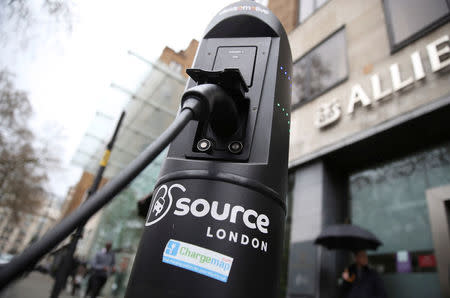 FILE PHOTO: An electric car is plugged into a charging point in London, Britain April 7, 2016. REUTERS/Neil Hall/File Photo