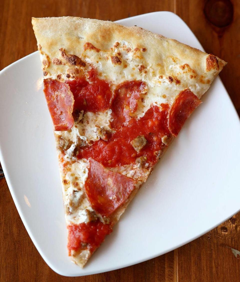 A slice of soppressata and sausage pizza at Olivella’s Pizza and Wine. Olivella’s is the winner of the Star-Telegram’s Reader’s Choice for best pizza in Fort Worth.