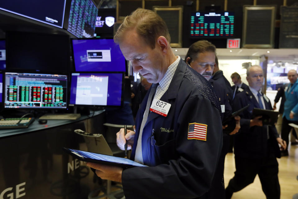 Trader Michael Smyth works on the floor of the New York Stock Exchange, Friday, Nov. 15, 2019. Stocks are opening broadly higher on Wall Street as hopes continued to grow that the U.S. and China were moving closer to a deal on trade. (AP Photo/Richard Drew)