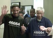 American actor Will Smith, left, with former South African President Nelson Mandela, right, during a photo call in Johannesburg, Thursday Sept 16, 2004. Smith is in South Africa to launch his new movie "I, Robot" and to discuss with Mandela his participation in the Nelson Mandela Foundation's 46664 campaign set up to create AIDS awareness in the country after last year's Mandela 46664 music concert held in Cape Town. The number 46664 is the prisoner number given to Mandela during his incarceration. (AP Photo/Denis Farrell)
