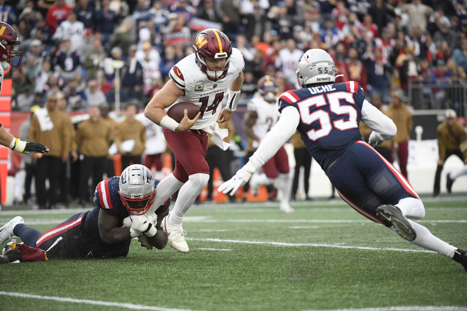 New England Patriots linebacker Ja’Whaun Bentley (8) tackles Washington Commanders quarterback Sam Howell (14). Mandatory Credit: Bob DeChiara-USA TODAY Sports