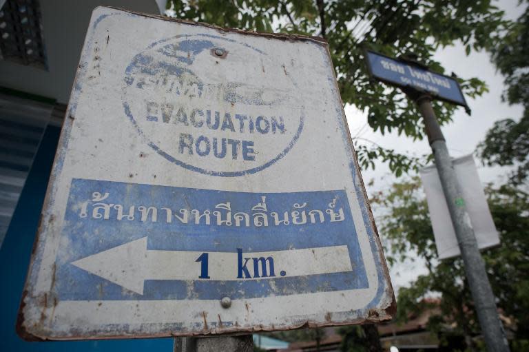 A faded tsunami sign in Khao Lak, Thailand. Ten years after the deadliest tsunami on record wrought destruction across the Indian Ocean, authorities fear creeping complacency is undermining a hi-tech warning system to prevent future disasters