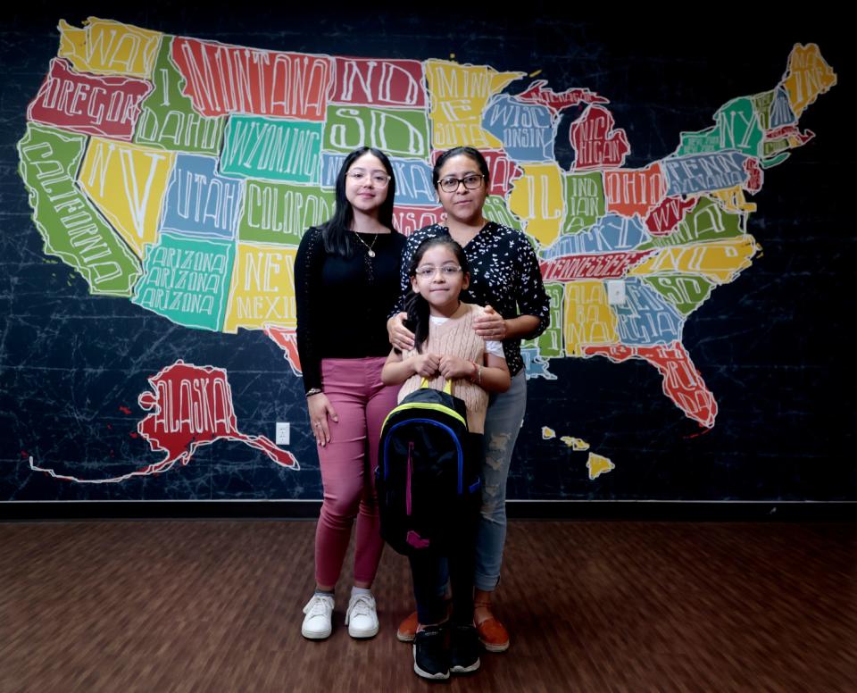 Maria Sanchez, 36, of Detroit, stands with two of her three kids: Danna Sanchez, 19, and Daleyza Sanchez, 6, inside Southwest Solutions in Detroit on Thursday, July 13, 2023. Sanchez has been volunteering at Southwest Solutions since 2015 and has taken advantage of their services for her family including their “Backpacks for Dreams” drive that gives backpacks filled with school supplies to children across Detroit who need them so parents can use the money they would have spent on school supplies for other bills like food and rent.