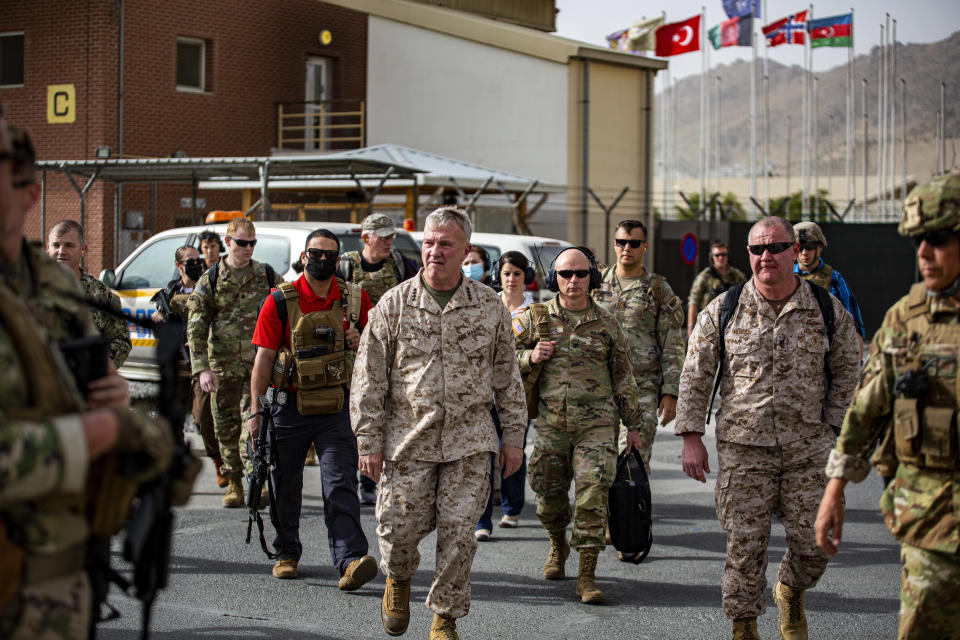 Gen. Kenneth F. McKenzie, center