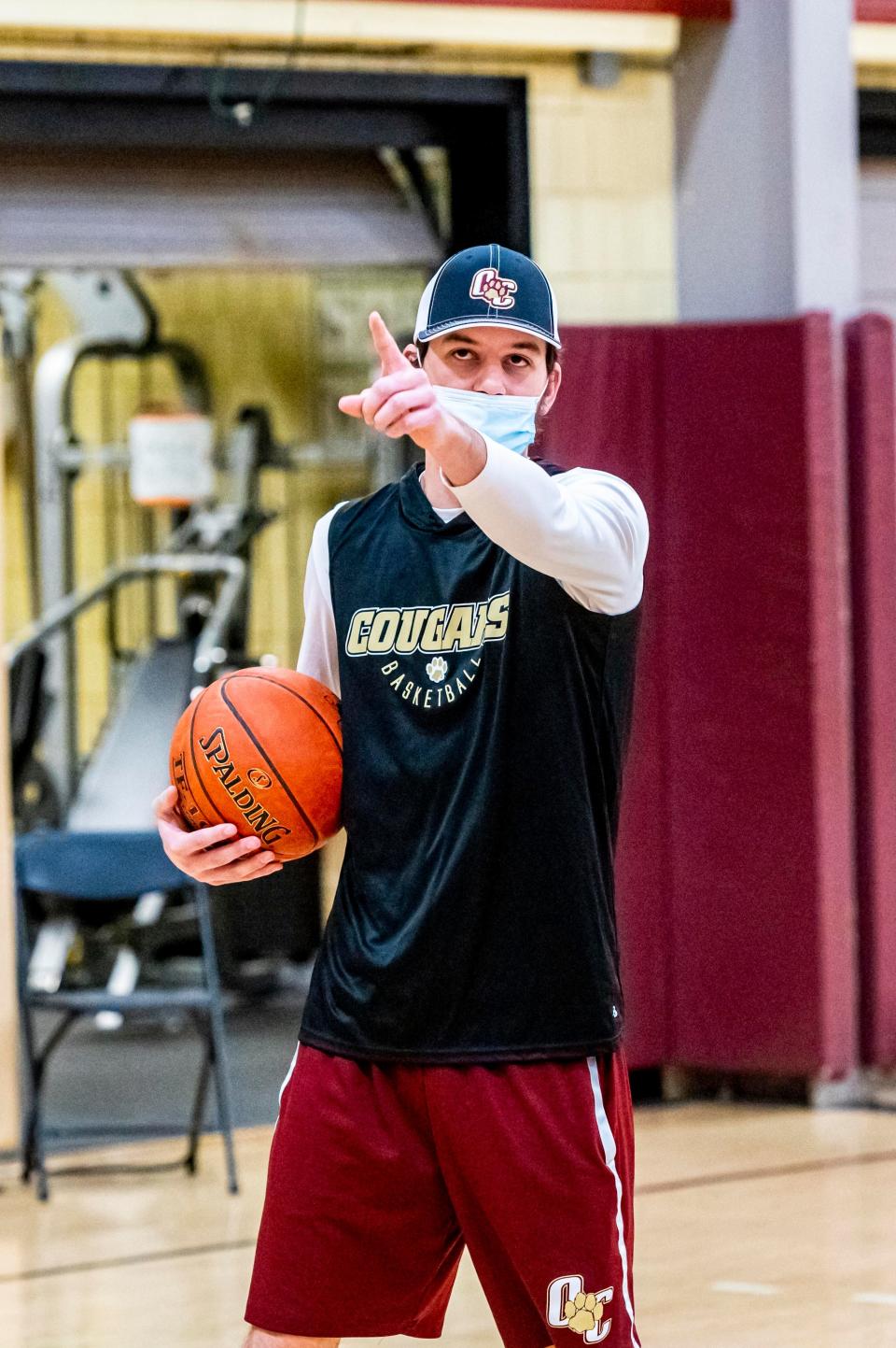 Old Colony assistant coach Jake Jason gives instructions to the team during practice.