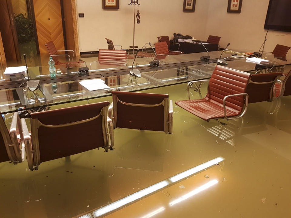 This picture made available Friday, Nov. 15, 2019 shows the Sala del Leone (Lion Hall) meeting room of the Veneto regional council in the Palazzo Ferro Fini palace, in Venice, Italy, early Wednesday Nov. 13, 2019 after its second-worst flooding on record late Tuesday when water levels reached 1.87 meters (6 feet, 1 inch). Exceptionally high tidal waters returned to Venice on Friday, prompting the mayor to close the iconic St. Mark’s Square and call for donations to repair the Italian lagoon city just three days after it experienced its worst flooding in 50 years. (Andrea Zanoni via AP)