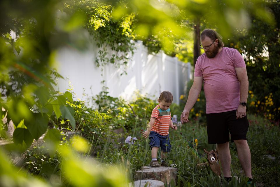 Josh Mitchell and his son, Conner, 1, play outside their home after dinner in Midvale on Tuesday, May 30, 2023. | Spenser Heaps, Deseret News