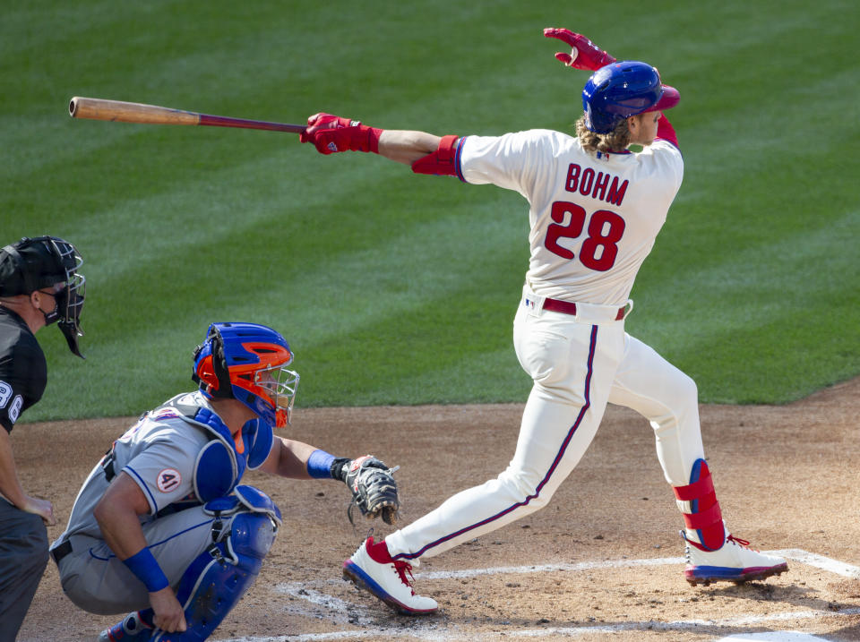 Philadelphia Phillies Alec Bohm (28) follows through on a home run during the first inning of a baseball game against the New York Mets, Wednesday, April 7, 2021, in Philadelphia. (AP Photo/Laurence Kesterson)