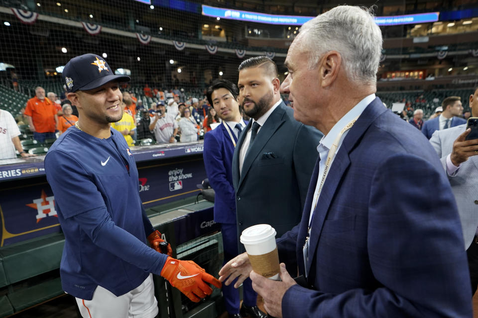 Houston Astros first baseman Yuli Gurriel, left, speaks with MLB Commissioner Robert D. Manfred Jr.before Game 2 of baseball's World Series between the Houston Astros and the Philadelphia Phillies on Saturday, Oct. 29, 2022, in Houston. (AP Photo/David J. Phillip)