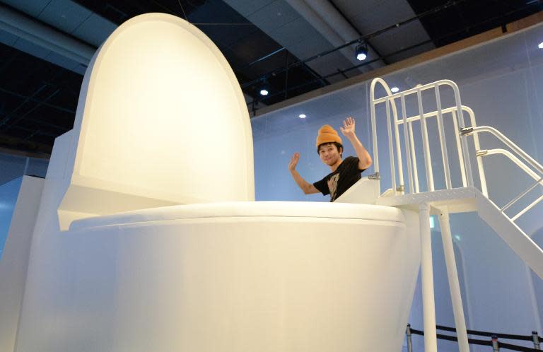 A giant toilet slide dominates a toilet exhibition at the National Museum of Emerging Science and Innovation in Tokyo in July 2014