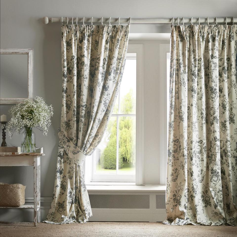 <p> Never underestimate the cosseting capabilities of curtains. They can be used to dress even the smallest  of windows and will help keep the heat inside  while bringing visual softness to your scheme. </p> <p> There is a host of options for window treatments and curtains when it comes to country decorating ideas. For curtains that fit the bill all year round, consider lining a bold floral with a classic check, plaid or stripe.  </p> <p> Opt for a simple heading that can be threaded onto a pole; this will ensure the curtain is easily reversible, allowing you to change the look with the seasons.  </p> <p> Even if  your window is small or awkwardly placed, a thickly lined curtain can add colour and warmth.  </p> <p> Here, Sanderson has used a single outsized curtain to make the small offset window appear bigger.  </p> <p> ‘Generous curtains in earthy tones create the perfect backdrop for cosy nights by the fireplace,’ says Rebecca Craig, lead designer at Sanderson. </p>