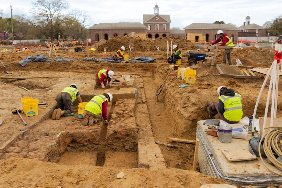 Colonial Williamsburg Archaeology staff investigates well found behind remains of 18th Century house at future Campbell Archaeology Center site.