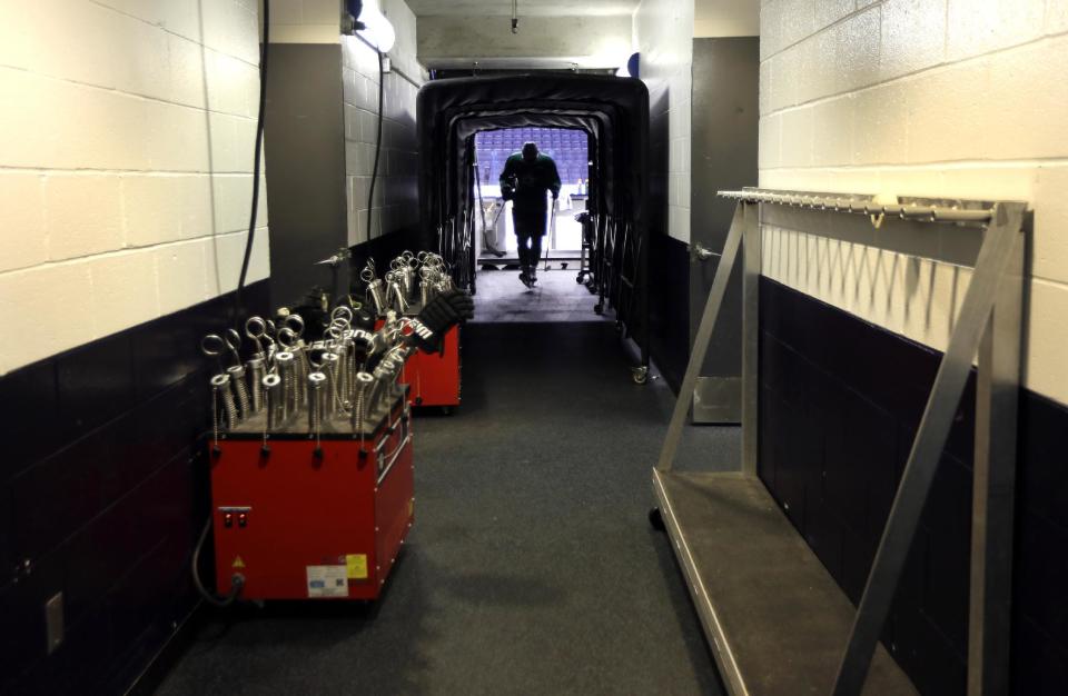 Dallas Stars' Valeri Nichushkin walks through a tunnel leading to the Stars' locker room following an NHL hockey practice Tuesday, March 11, 2014, in St. Louis. Dallas Stars' Rich Peverley is undergoing testing to determine what triggered his collapse during a game Monday night in Dallas. The Stars are scheduled to play the St. Louis Blues tonight in St. Louis. (AP Photo/Jeff Roberson)