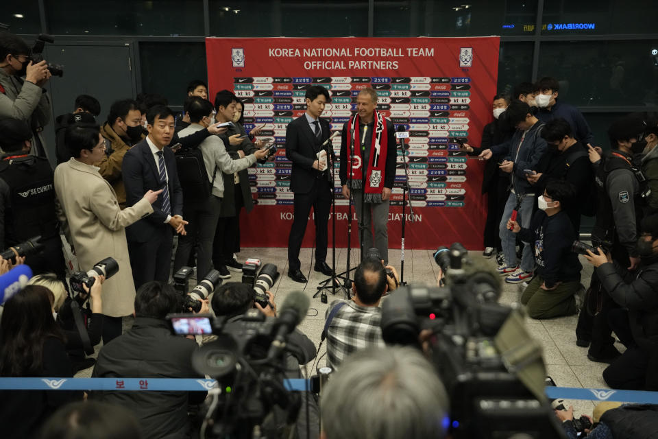 South Korea's new national soccer team head coach Jurgen Klinsmann, top center right, speaks during a press conference at the Incheon International Airport in Incheron, South Korea, Wednesday, March 8, 2023. Klinsmann, who won the World Cup as a player with West Germany in 1990, replaces Paulo Bento. The Portuguese coach left the team after leading South Korea to the second round at last year's World Cup in Qatar. (AP Photo/Ahn Young-joon)