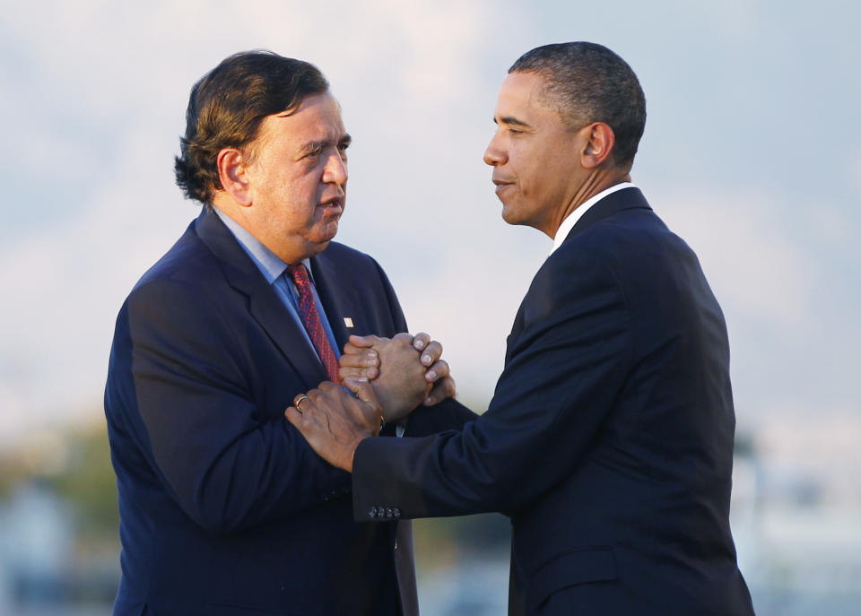 FILE - In this Sept. 27, 2010 file photo, President Barack Obama is greeted by New Mexico Gov. Bill Richardson, as he steps off Air Force One at Kirtland Air Force Base in Albuquerque, N.M. (AP Photo/Charles Dharapak, File)