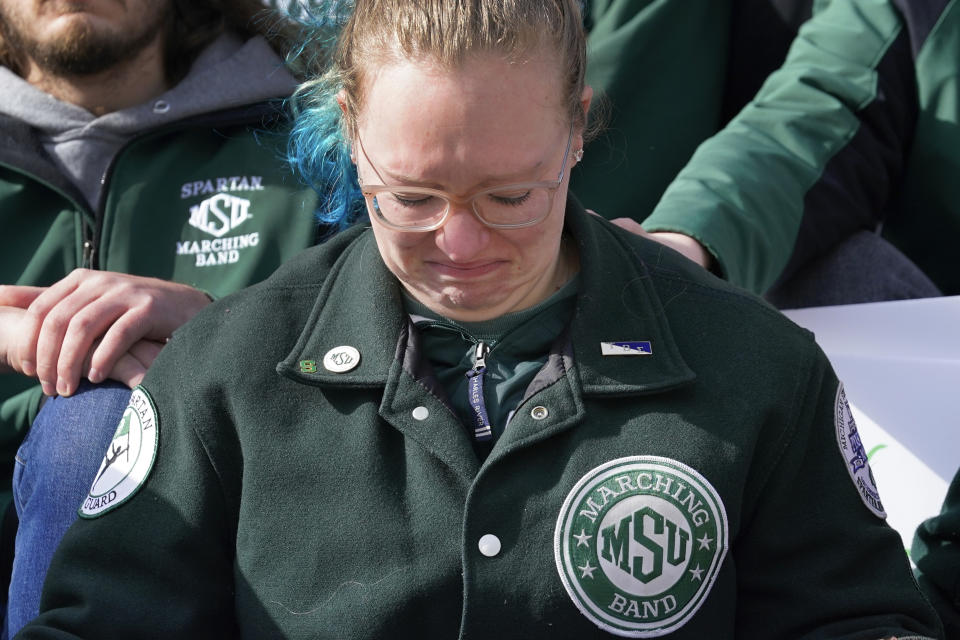 Libby Draeger cries during a rally with current and former Michigan State University students at the capitol in Lansing, Mich., Wednesday, Feb. 15, 2023. Alexandria Verner, Brian Fraser and Arielle Anderson were killed and other students remain in critical condition after a gunman opened fire on the campus of Michigan State University Monday night. (AP Photo/Paul Sancya)