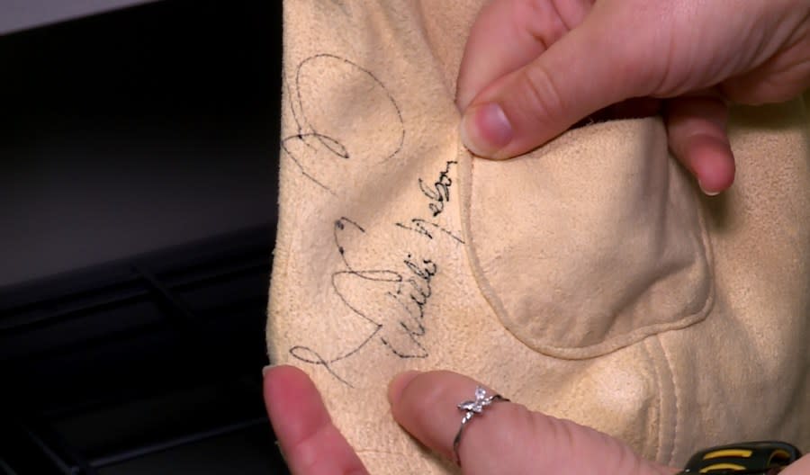 Willie Nelson’s signature on a vest worn by a former crew member of Austin City Limits TV show, signed by various performers (KXAN Photo/Ed Zavala)