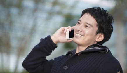 Portrait of businessman talking cell phone