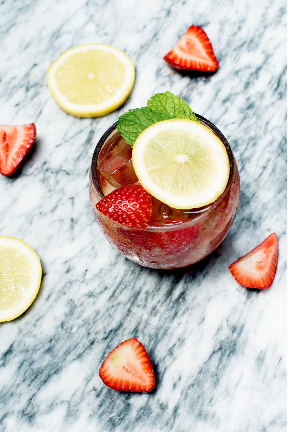 <strong>Summer Solstice Spritz</strong><br><br>Perfect for the week before payday, this rosé spritz is easy on the ingredient list and super-quick to whip up.<br><br><strong>Ingredients</strong><br>125ml dry rosé wine<br>50ml sparkling water or soda<br>3 strawberries<br><br><em>Optional</em><br>Sprig of mint<br>Slice of lemon<br><br><strong>Method</strong><br>Muddle the strawberries at the bottom of a large wine glass and fill with ice. Add the wine and top with soda. Garnish with the mint and lemon if you're using them.<br><br><em>Serves 1. </em><span class="copyright">Photographed by Roxana Azar.</span>