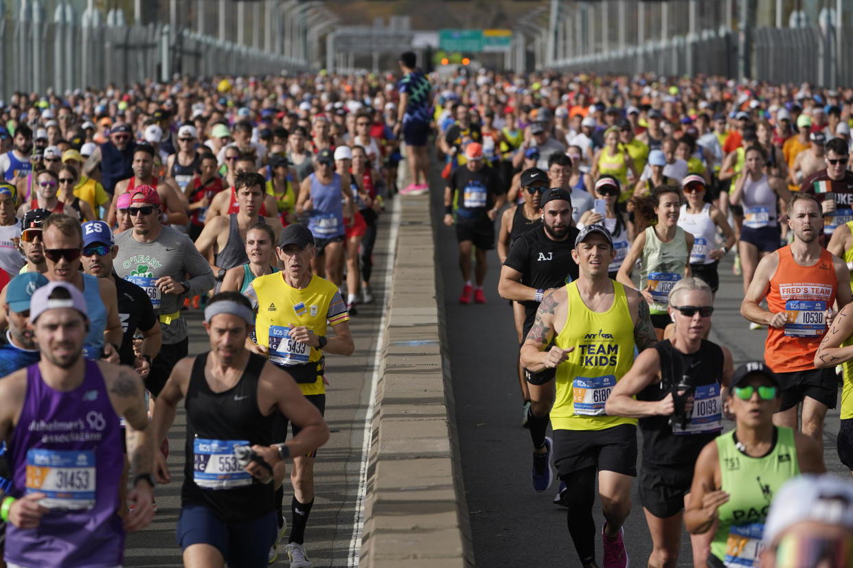 Runners cross the Verrazzano-Narrows Bridge at the start of the New York City Marathon in New York, Sunday, Nov. 6, 2022. (AP Photo/Seth Wenig)