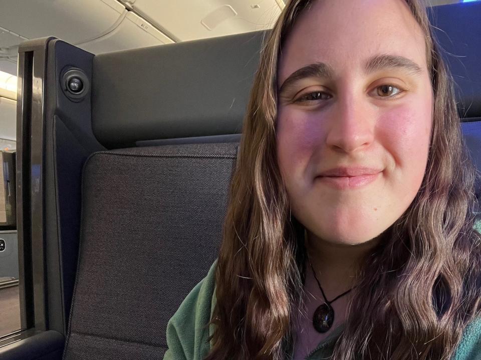 A selfie of the author in the seat wearing a green fleece sweater.