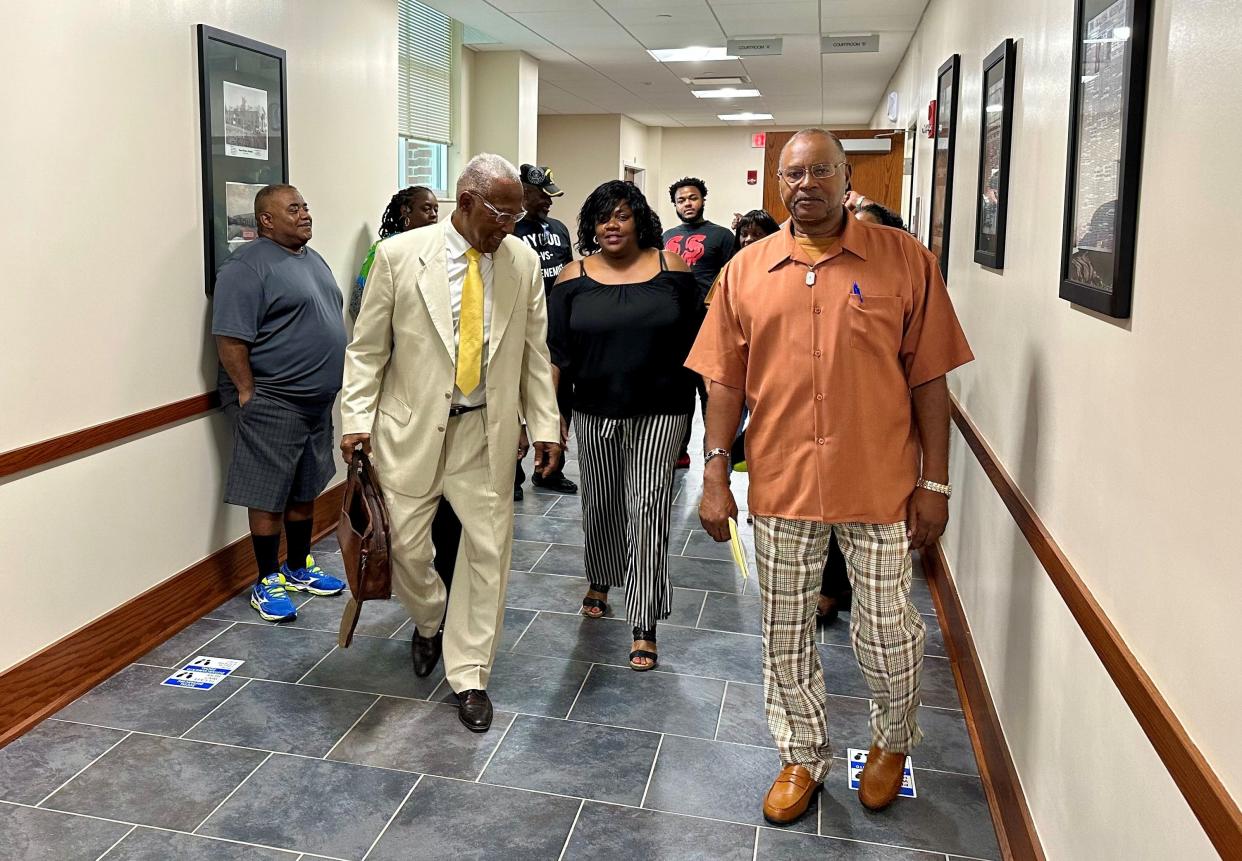 Kimbra Williams (center), the sister of the late Tarina White, and her lawyer, Fred Flowers of Tallahassee, leave the courtroom after a hearing at the Okaloosa County Courthouse in Crestview on June 5, 2023.