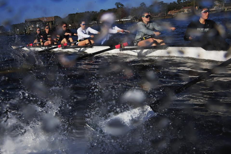 Jacksonville University women's rowers practice on the St. Johns River. From the right are Bella Miletich (7 seat), Katy Kost (6 seat), Holly Rosser (5 seat), Megan Helge (4 seat), Teagan Castleberry (3 seat), Sam Keough (2 seat), and Emma Domingo (bow). The team has been invited to participate in the Henley Royal Regatta near Londond in July.