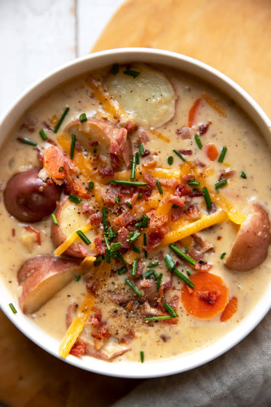 <p>Modern Crumb</p><p>Fully loaded baked potato chowder with the creamiest, cheesy soup base.</p><p><strong>Get the recipe: <a href="https://moderncrumb.com/loaded-baked-potato-chowder/" rel="nofollow noopener" target="_blank" data-ylk="slk:Loaded Baked Potato Chowder;elm:context_link;itc:0;sec:content-canvas" class="link ">Loaded Baked Potato Chowder</a></strong></p><p><strong>Related: <a href="https://parade.com/1141369/kristamarshall/slow-cooker-chowder-recipes/" rel="nofollow noopener" target="_blank" data-ylk="slk:22 Easy and Delicious Crock Pot Chowder Recipes;elm:context_link;itc:0;sec:content-canvas" class="link ">22 Easy and Delicious Crock Pot Chowder Recipes</a></strong></p>