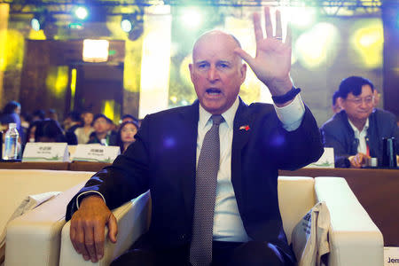 California Governor Jerry Brown attends International Forum on Electric Vehicle Pilot Cities and Industrial Development in Beijing, China June 6, 2017. REUTERS/Thomas Peter