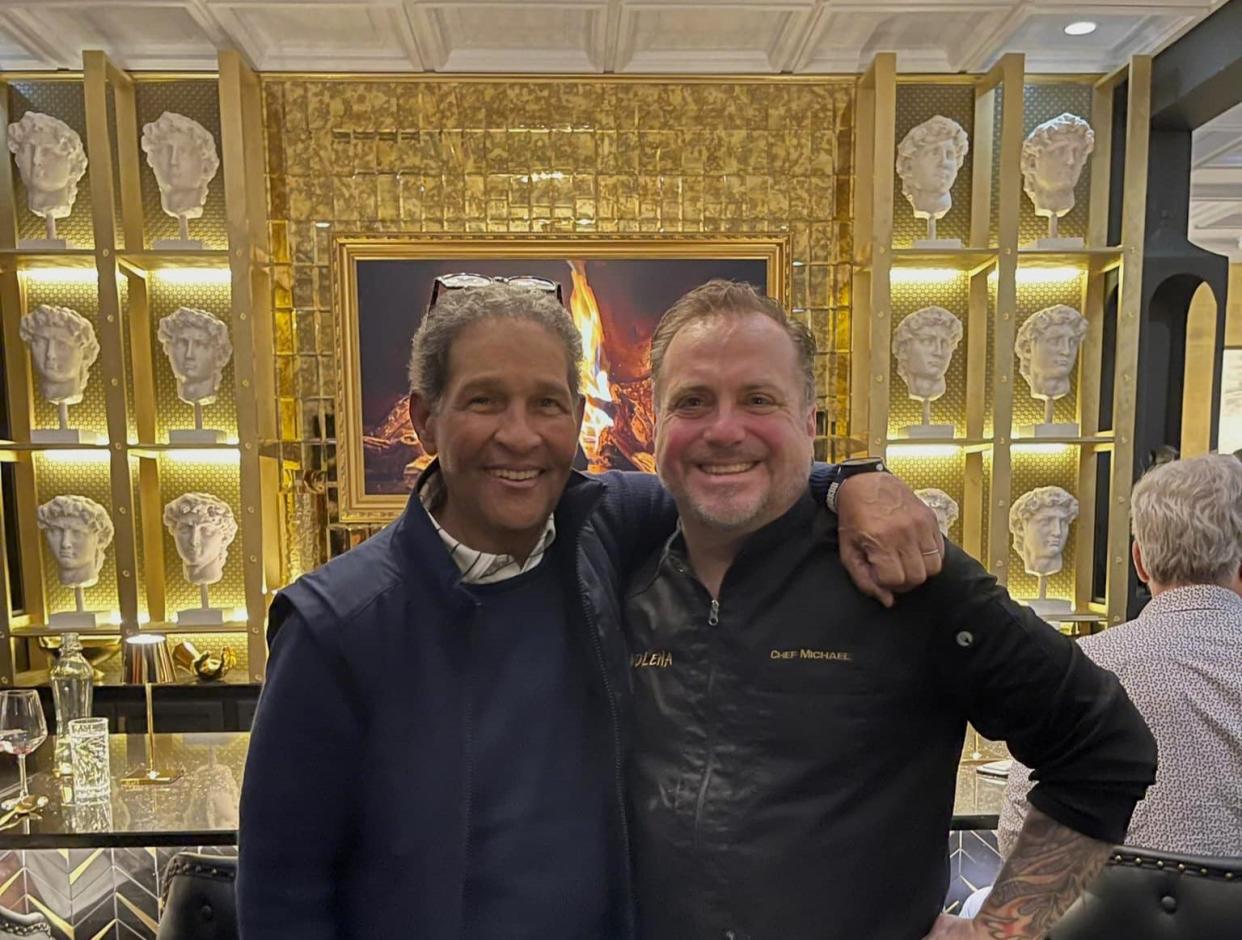 At Tavolena restaurant in Jupiter, chef/owner Michael Rolchigo shares a snapshot with a famous patron: veteran sports commentator Bryant Gumbel.