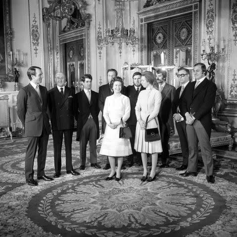 <p>PA Images via Getty</p> An informal moment at Buckingham Palace, where Queen Elizabeth, watched by Princess Anne (r), thanked the seven heroes who went to the assistance of Princess Anne during the Ian Ball's attempt to kidnap her.