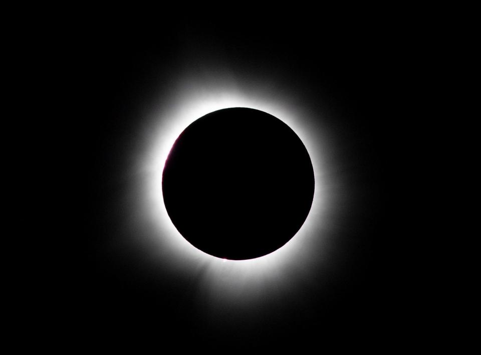 The total solar eclipse seen above downtown Evansville, Ind., Monday, April 8, 2024.