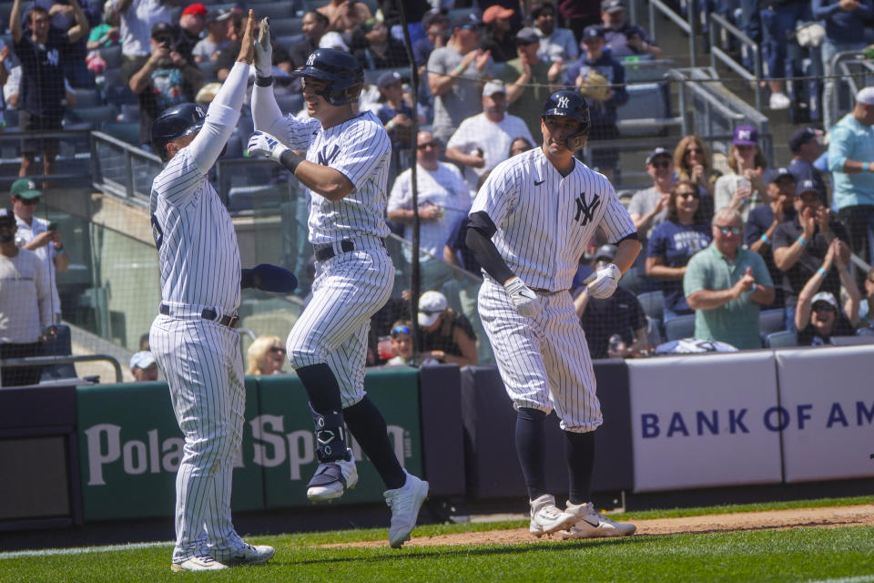 New York Yankees' Anthony Volpe, center, celebrates his grand slam homer in the fifth inning against the Oakland Athletics, Wednesday, May 10, 2023, in New York. (AP Photo/Bebeto Matthews)