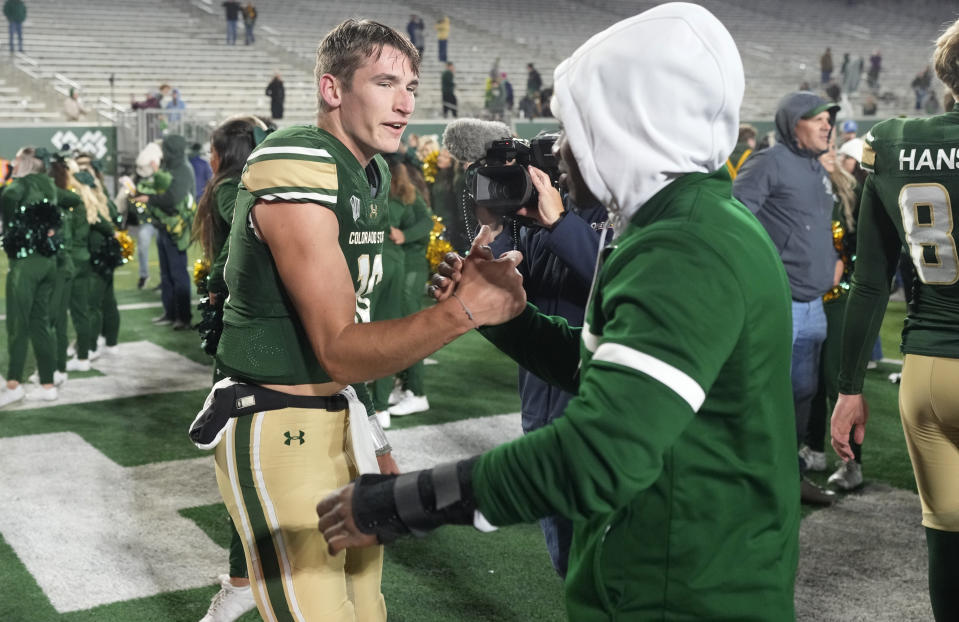 Colorado State quarterback Brayden Fowler-Nicolosi, left, is congratulated after leading his team to a last-second victory over Boise State in an NCAA college football game Saturday, Oct. 14, 2023, in Fort Collins, Colo. (AP Photo/David Zalubowski)