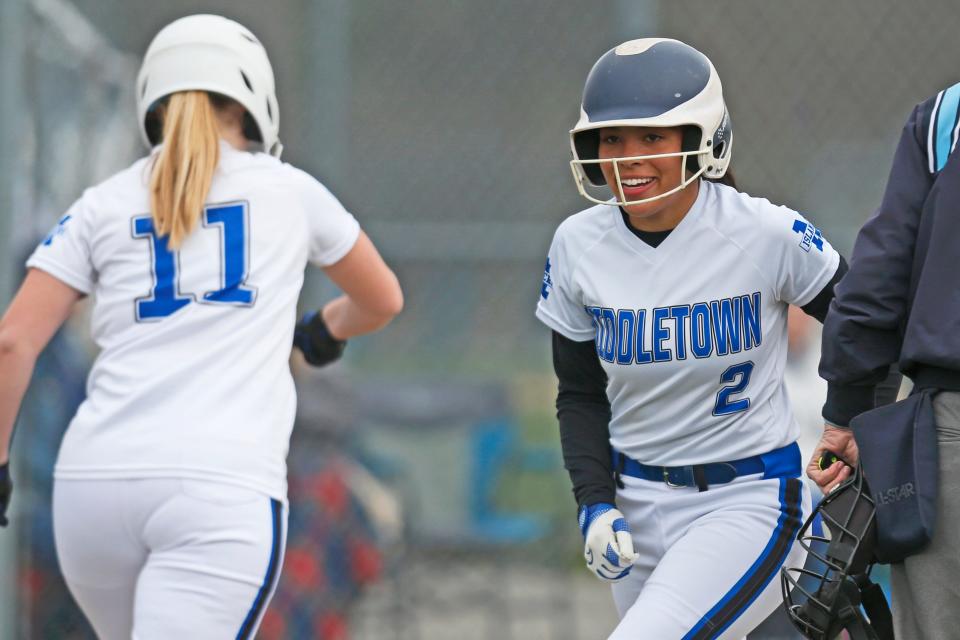 Middletown's Ella Bolano flashes a smile after scoring a run in the first inning of the Islanders' game against BNS on Wednesday afternoon.