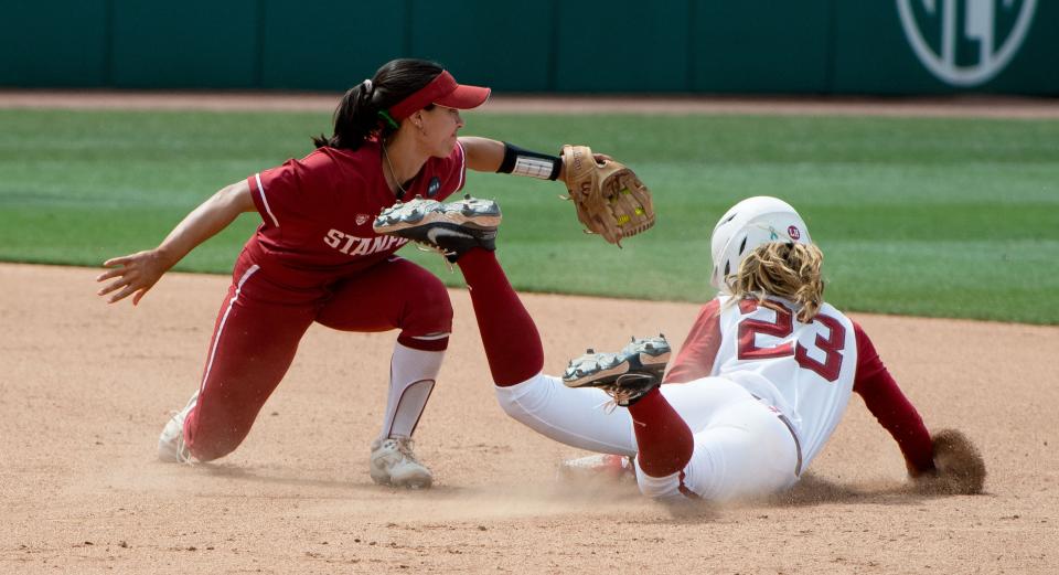 May 22, 2022; Tuscaloosa, AL, USA; Alabama base runner M'Kay Gidley (1) tags out Alabama right fielder Savannah Woodard (23) on a steal attempt. The Stanford Cardinal defeated the Alabama Crimson Tide 6-0 to claim the NCAA Tuscaloosa Regional title Sunday. Mandatory Credit: Gary Cosby Jr.-The Tuscaloosa News