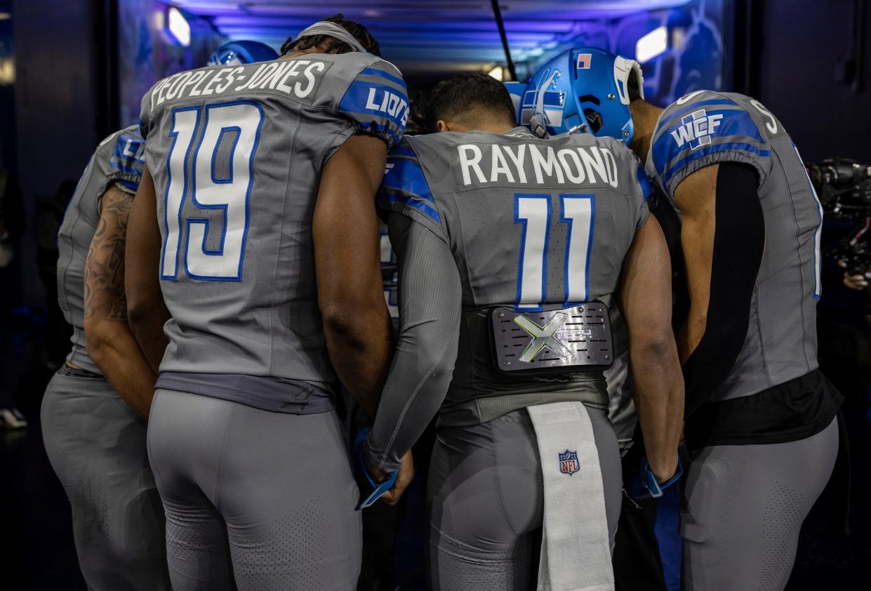Detroit Lions receivers including Donovan Peoples-Jones and Kalif Raymond pray before the start of the game against the Minnesota Vikings at Ford Field in Detroit on Sunday, Jan. 7, 2024.